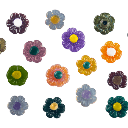 These are Glass Flower Choose-A-Charms by Technicolor Tony available at Handmade Glass Co. Featuring customizable backing and handmade here in Denver, CO these unique glass charms are a vibrant way to show off some color.
