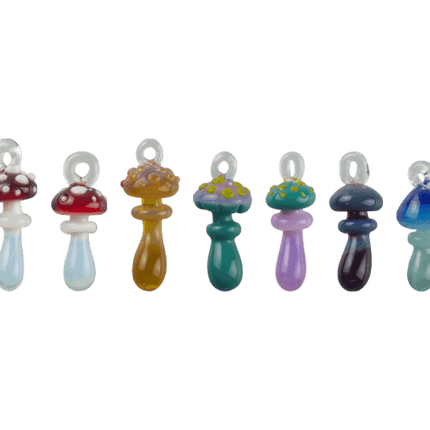 These are Loop Mushroom Pendants by Technicolor Tony available at Handmade Glass Co. Featuring vibrant glass colors these handmade jewelry pieces are crafted in Denver, CO.