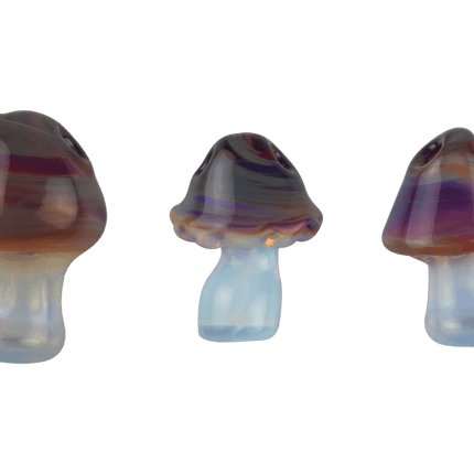 These are Swirling Shroom Glass Pendants by Technicolor Tony available at Handmade Glass Co. Featuring Amber Purple and Ghost glass with two holes so you can thread them onto your favorite necklace.