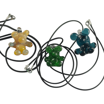 These are Glass Gummy Bear Pendants by Biting Glass available at Handmade Glass Co. Fun handmade borosilicate glass jewelry piece made in Denver, Colorado.