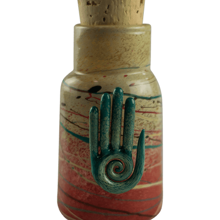 This is the Eternal Life Glass Jar by Maze Glass available at Handmade Glass Co. Featuring a cork stopper and Eternal Life pendant this is a one-of-a-kind glass jar.