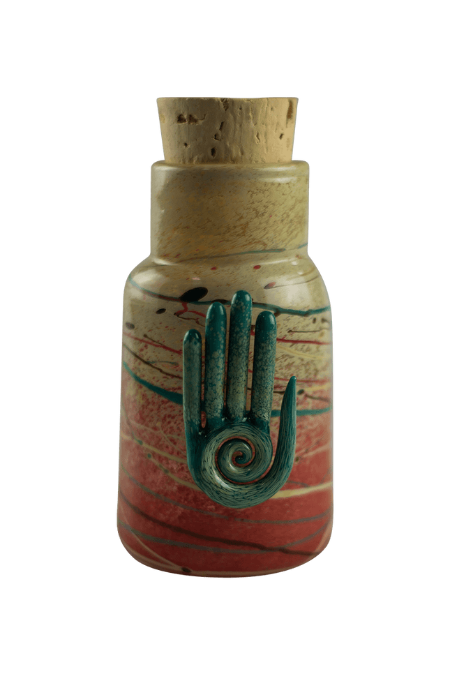This is the Eternal Life Glass Jar by Maze Glass available at Handmade Glass Co. Featuring a cork stopper and Eternal Life pendant this is a one-of-a-kind glass jar.
