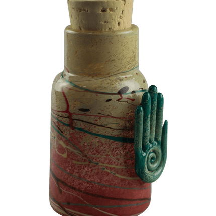 This is the Eternal Life Glass Jar by Maze Glass available at Handmade Glass Co. Featuring a cork stopper and Eternal Life pendant this is a one-of-a-kind glass jar.