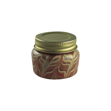 This is the Screw Top Glass Jar by Maze Glass available at Handmade Glass Co. Featuring intricate glass patterns and a threaded lid this is a functional and artistic American glass jar.