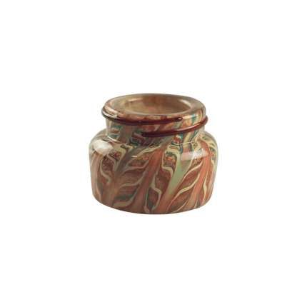 This is the Screw Top Glass Jar by Maze Glass available at Handmade Glass Co. Featuring intricate glass patterns and a threaded lid this is a functional and artistic American glass jar.