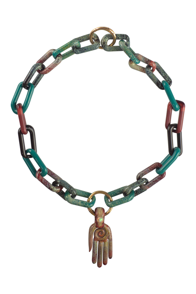 This is a collab glass chain necklace by Technicolor Tony & Maze Glass available at Handmade Glass Co. Made here in Denver and featuring accents from both artists this is a one-of-a-kind impressive glass masterpiece.