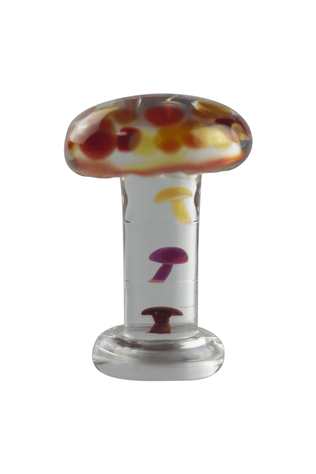 This is the Mushroom Desk Sculpture by Biting Glass available at Ritual Colorado. A sleek glass sculpture featuring colorful mushrooms stacked inside the stem of a large clear mushroom.