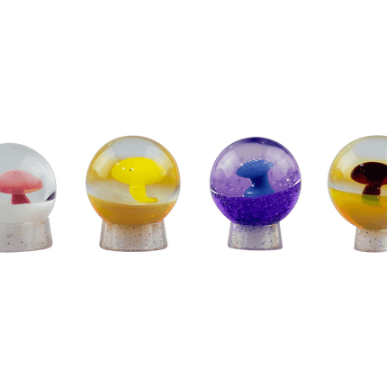 This is a set of Colorful Mushroom Marbles by Biting Glass available at Handmade Glass Co. Featuring a vibrant mushroom with complementary color backing and fully handmade from borosilicate glass.