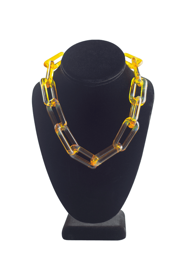 This is the Northstar Yellow Glass Choker Chain by Technicolor Tony available at Handmade Glass Co. Handmade in Denver, Colorado this unique glass chain features subtle details for a statement jewelry piece.