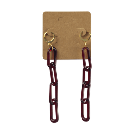 These are Red Elvis Glass Chain Earrings by Technicolor Tony available at Handmade Glass Co. Made locally in Denver, Colorado these vibrant jewelry pieces feature links of glass dangling from leverback earring hooks.