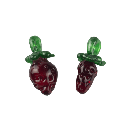 These are Strawberry Glass Pendants by Technicolor Tony available at Handmade Glass Co. Featuring vibrant textured red bodies accented by green leaves and a sparkly bail.