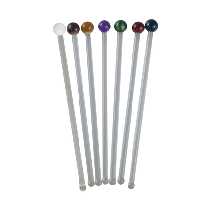 These are handmade Glass Cocktail Swizzle Sticks by Biting Glass available at Handmade Glass Co. Featuring vibrant glass marble toppers and rounded bottom to easily stir up your favorite drink.