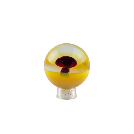 This is the Red Elvis / Striking Yellow Colorful Mushroom Marble by Biting Glass available at Handmade Glass Co. Featuring a vibrant mushroom with complementary color backing and fully handmade from borosilicate glass.
